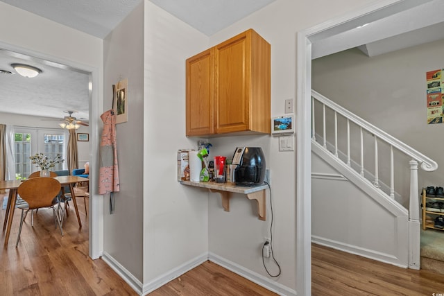 830 44th Ave N Unit T3, Myrtle Beach, SC 29577 - hallway with light wood-style flooring, stairway, and baseboards