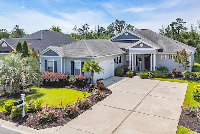 773 Wintercreeper Dr, Longs, SC 29568 - single story home with an attached garage, a front lawn, driveway, and roof with shingles