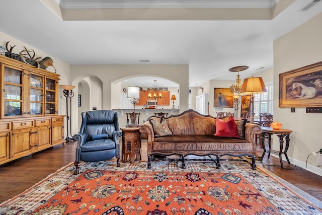 773 Wintercreeper Dr, Longs, SC 29568 - living area with a chandelier, dark wood-style floors, ornamental molding, and arched walkways