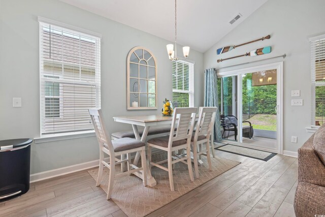 1178 Pyxie Moss Dr, Little River, SC 29566 - dining room with hardwood / wood-style flooring, a chandelier, lofted ceiling, and baseboards