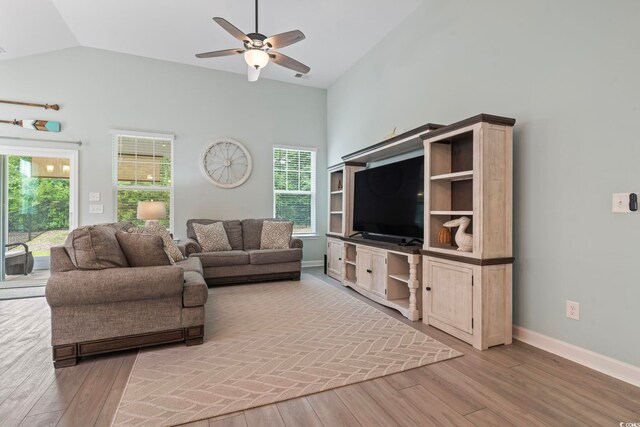 1178 Pyxie Moss Dr, Little River, SC 29566 - living room with a ceiling fan, light wood-style floors, baseboards, and high vaulted ceiling