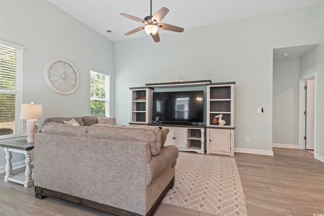 1178 Pyxie Moss Dr, Little River, SC 29566 - living room with ceiling fan, light wood finished floors, high vaulted ceiling, and baseboards