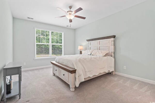 1178 Pyxie Moss Dr, Little River, SC 29566 - bedroom with baseboards, light colored carpet, and a ceiling fan