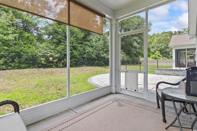 1178 Pyxie Moss Dr, Little River, SC 29566 - sunroom / solarium featuring view of scattered trees