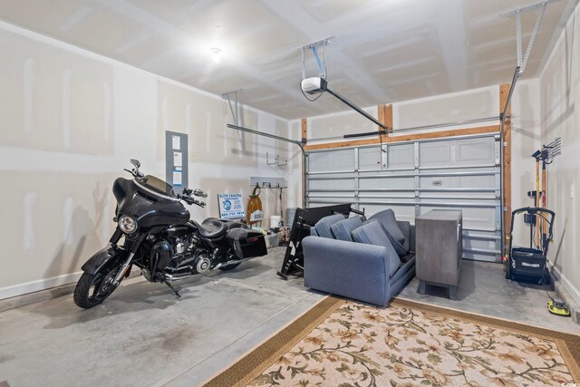 1178 Pyxie Moss Dr, Little River, SC 29566 - garage with a garage door opener and baseboards