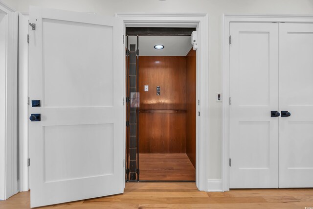 573 S Dunes Dr, Pawleys Island, SC 29585 - elevator with wood finished floors and recessed lighting