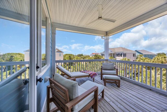 573 S Dunes Dr, Pawleys Island, SC 29585 - deck featuring a ceiling fan and a residential view