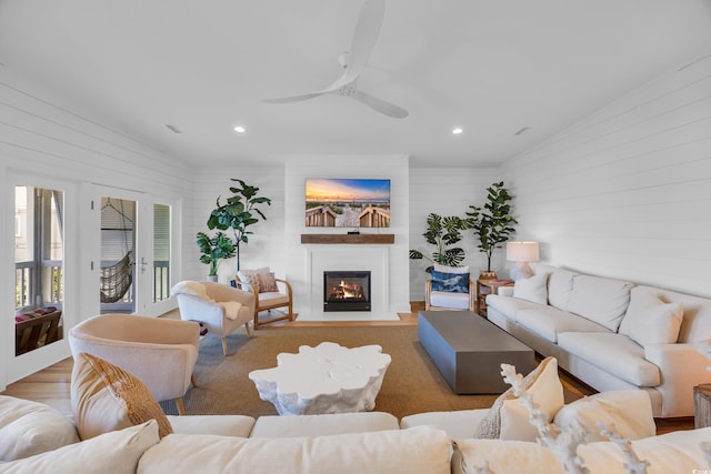 573 S Dunes Dr, Pawleys Island, SC 29585 - living room with a glass covered fireplace, recessed lighting, wooden walls, and ceiling fan