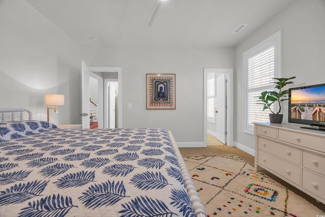 573 S Dunes Dr, Pawleys Island, SC 29585 - bedroom featuring baseboards and light carpet
