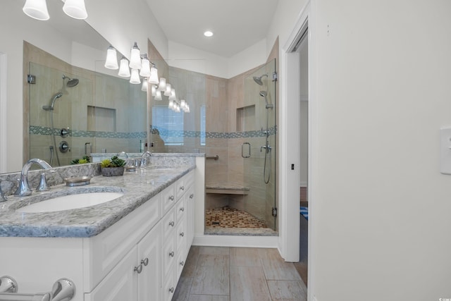 573 S Dunes Dr, Pawleys Island, SC 29585 - bathroom featuring double vanity, a stall shower, and recessed lighting