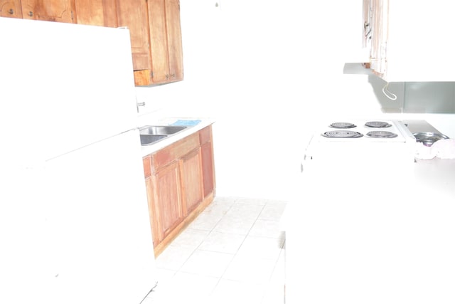 3909 Mallard Cir, Myrtle Beach, SC 29579 - kitchen featuring freestanding refrigerator, light countertops, and light tile patterned floors