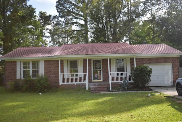 3909 Mallard Cir, Myrtle Beach, SC 29579 - ranch-style home featuring an attached garage, covered porch, metal roof, a front lawn, and brick siding