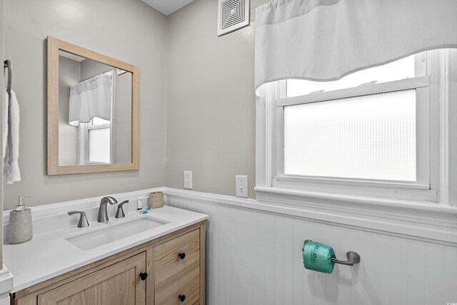2006 S Ocean Blvd, North Myrtle Beach, SC 29582 - bathroom with vanity and wainscoting