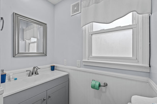 2006 S Ocean Blvd, North Myrtle Beach, SC 29582 - half bathroom with wainscoting, vanity, and toilet