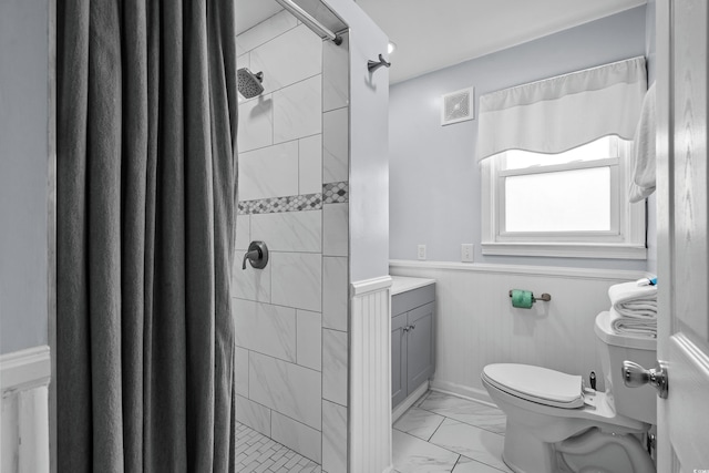 2006 S Ocean Blvd, North Myrtle Beach, SC 29582 - full bath featuring marble finish floors, toilet, a wainscoted wall, vanity, and a shower stall