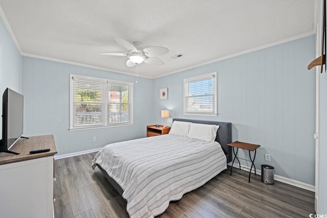 312 35th Ave N, North Myrtle Beach, SC 29582 - bedroom with crown molding, multiple windows, wood finished floors, and a ceiling fan