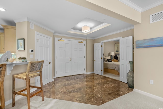 8500 Margate Cir Unit 505, Myrtle Beach, SC 29572 - entrance foyer with ornamental molding, a tray ceiling, and marble finish flooring