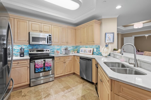 8500 Margate Cir Unit 505, Myrtle Beach, SC 29572 - kitchen with stainless steel appliances, a tray ceiling, light brown cabinetry, ornamental molding, and tasteful backsplash