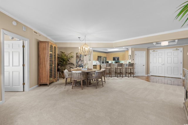 8500 Margate Cir Unit 505, Myrtle Beach, SC 29572 - dining room with ornamental molding, light carpet, and a chandelier