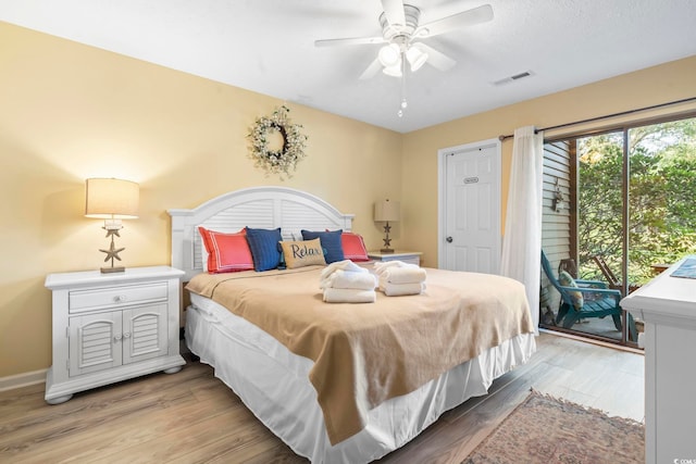 45 Pinehurst Ln Unit 2C, Pawleys Island, SC 29585 - bedroom with access to exterior, light wood finished floors, and ceiling fan