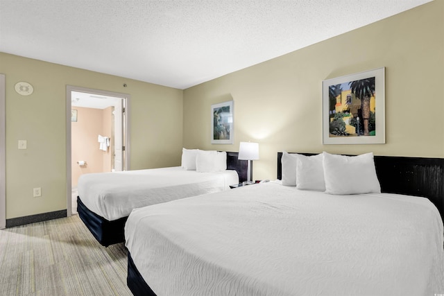 2301 S Ocean Blvd Unit 1405, North Myrtle Beach, SC 29582 - bedroom with light colored carpet and ensuite bath