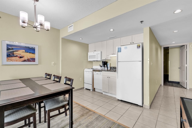 2301 S Ocean Blvd Unit 1405, North Myrtle Beach, SC 29582 - kitchen featuring white appliances, white cabinets, light tile patterned flooring, a chandelier, and recessed lighting