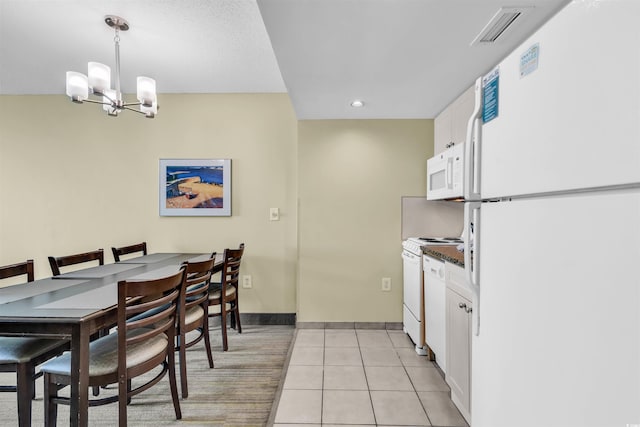 2301 S Ocean Blvd Unit 1405, North Myrtle Beach, SC 29582 - dining space with a chandelier, recessed lighting, baseboards, and light tile patterned floors