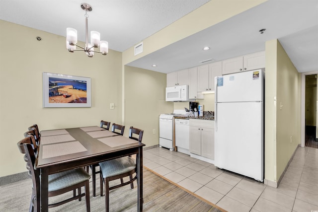 2301 S Ocean Blvd Unit 1405, North Myrtle Beach, SC 29582 - dining space featuring light tile patterned flooring, a chandelier, recessed lighting, and baseboards