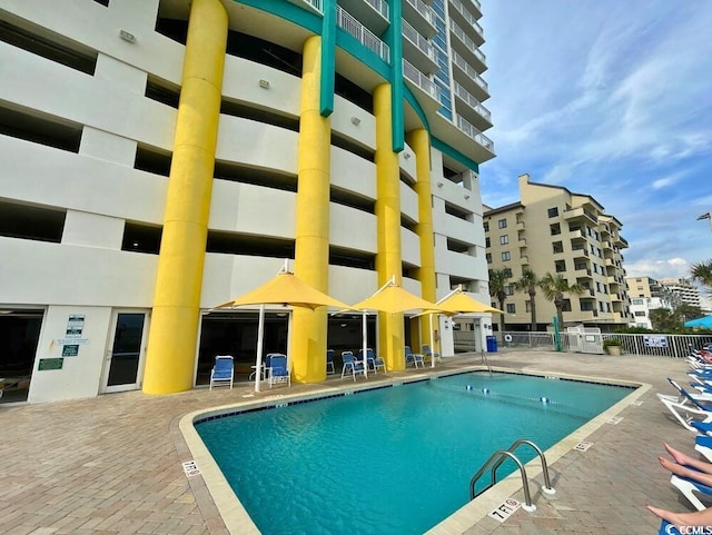2301 S Ocean Blvd Unit 1405, North Myrtle Beach, SC 29582 - community pool featuring a patio
