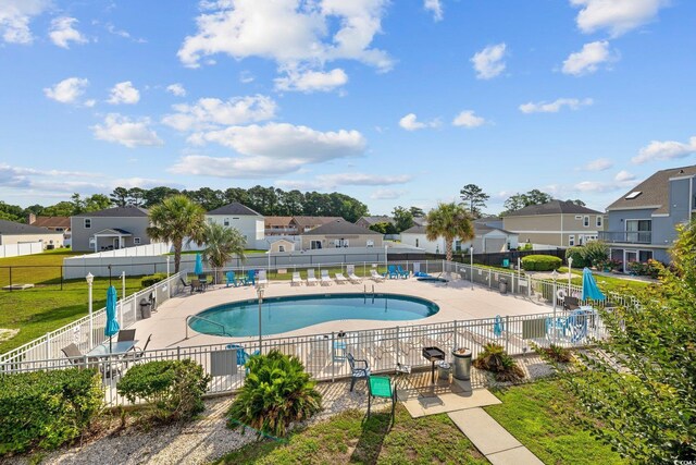 1890 Colony Dr Unit 17L, Surfside Beach, SC 29575 - community pool featuring a residential view and a patio area