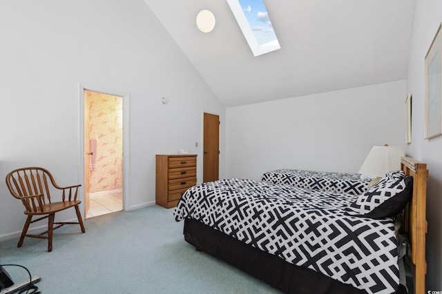 1890 Colony Dr Unit 17L, Surfside Beach, SC 29575 - carpeted bedroom featuring a skylight, high vaulted ceiling, ensuite bathroom, and baseboards