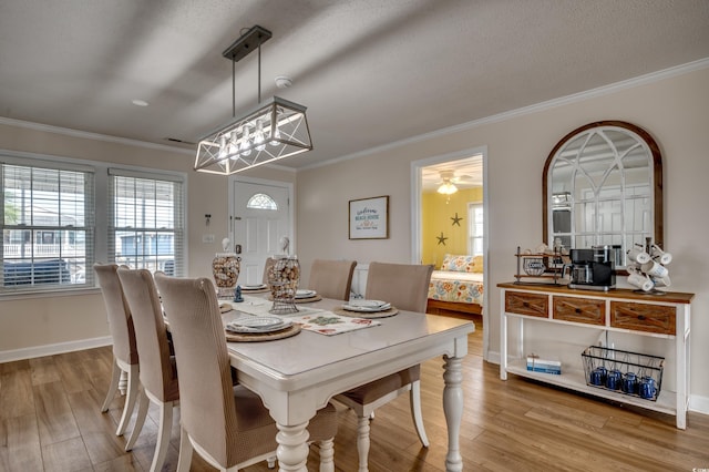 321 53rd Ave N, North Myrtle Beach, SC 29582 - dining area featuring crown molding, wood finished floors, and a textured ceiling