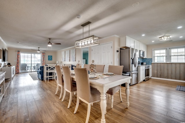 321 53rd Ave N, North Myrtle Beach, SC 29582 - dining space with plenty of natural light, ceiling fan, light wood-type flooring, a textured ceiling, and recessed lighting