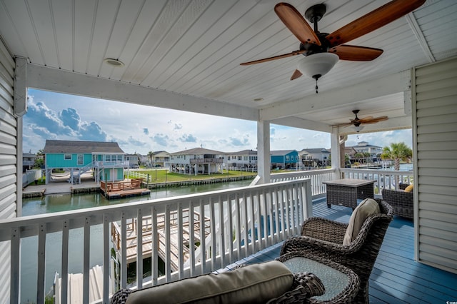 321 53rd Ave N, North Myrtle Beach, SC 29582 - wooden deck with a water view, a residential view, and a ceiling fan