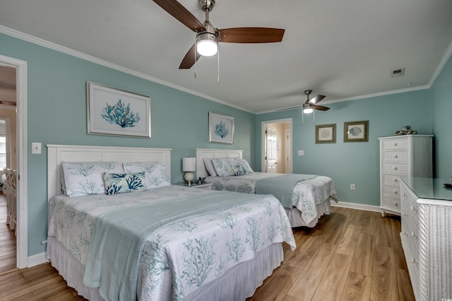 321 53rd Ave N, North Myrtle Beach, SC 29582 - bedroom with crown molding, wood finished floors, and a ceiling fan