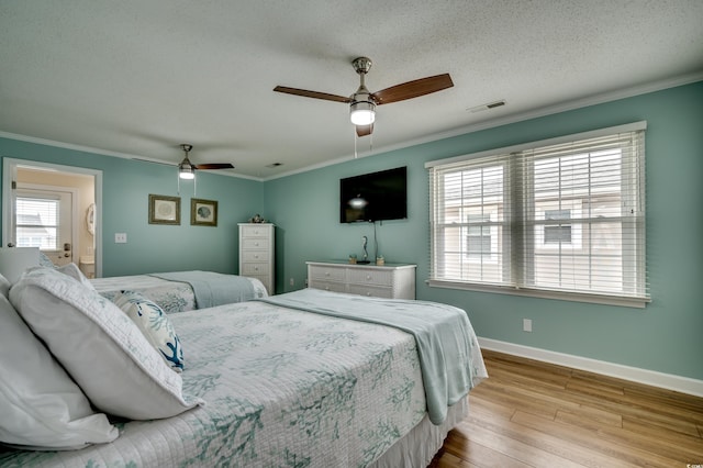 321 53rd Ave N, North Myrtle Beach, SC 29582 - bedroom featuring wood finished floors, crown molding, ceiling fan, and a textured ceiling