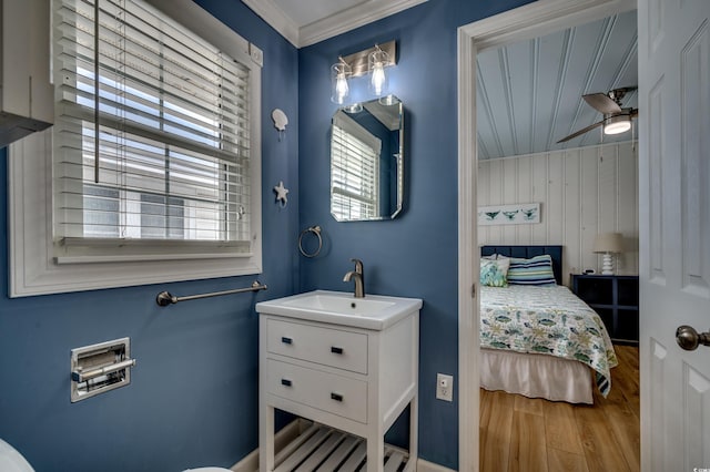 321 53rd Ave N, North Myrtle Beach, SC 29582 - bathroom featuring wood finished floors, a ceiling fan, vanity, and ornamental molding