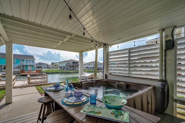 321 53rd Ave N, North Myrtle Beach, SC 29582 - wooden terrace with a hot tub, a water view, outdoor dining space, and a residential view