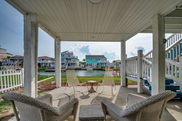 321 53rd Ave N, North Myrtle Beach, SC 29582 - view of patio featuring a water view, stairway, and a residential view