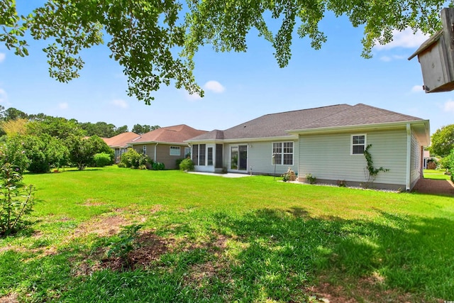 435 Seneca St NW, Calabash, NC 28467 - rear view of property featuring a yard