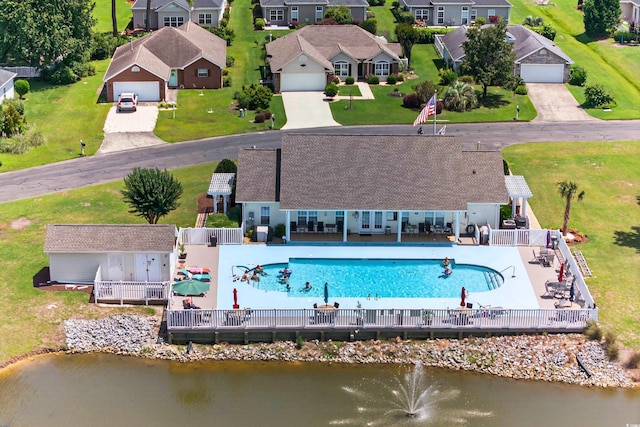 435 Seneca St NW, Calabash, NC 28467 - aerial perspective of suburban area featuring a pool area and a large body of water