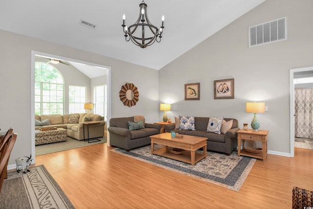 161 Patriot Ln, Pawleys Island, SC 29585 - living area featuring light wood-style floors, high vaulted ceiling, a chandelier, and a ceiling fan