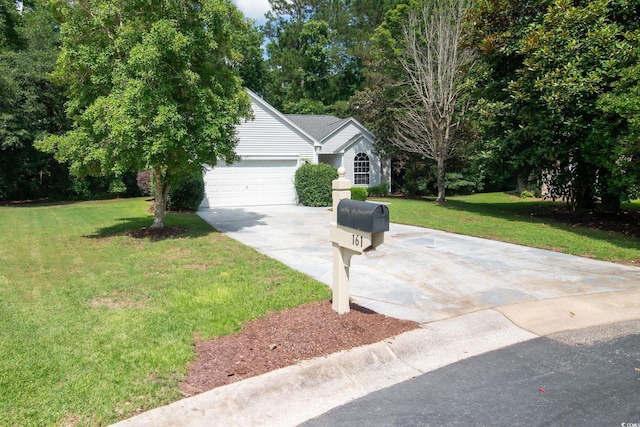 161 Patriot Ln, Pawleys Island, SC 29585 - view of front facade featuring driveway, a front yard, and a garage