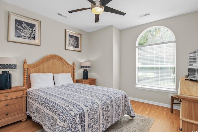 161 Patriot Ln, Pawleys Island, SC 29585 - bedroom with light wood-style floors and a ceiling fan