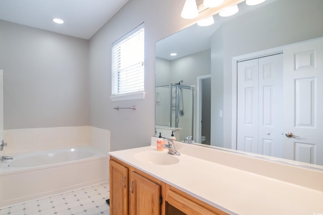 161 Patriot Ln, Pawleys Island, SC 29585 - bathroom with a stall shower, a garden tub, tile patterned floors, vanity, and a closet