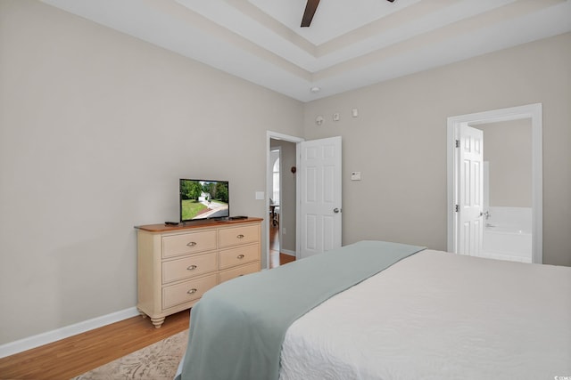 161 Patriot Ln, Pawleys Island, SC 29585 - bedroom featuring light wood-style flooring, ensuite bath, and ceiling fan