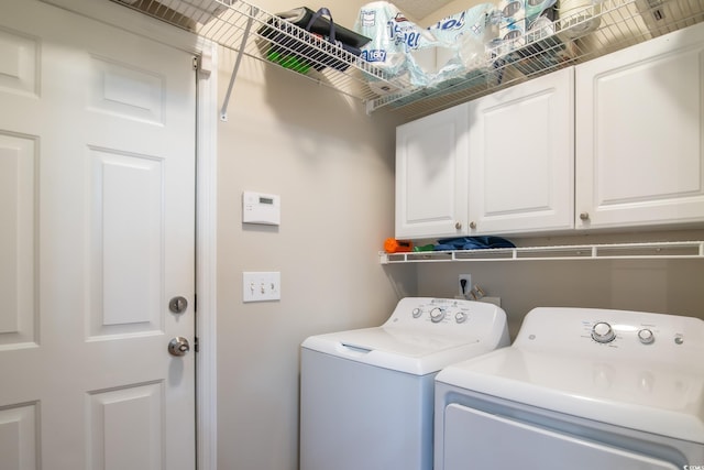 161 Patriot Ln, Pawleys Island, SC 29585 - washroom with washer and clothes dryer and cabinet space