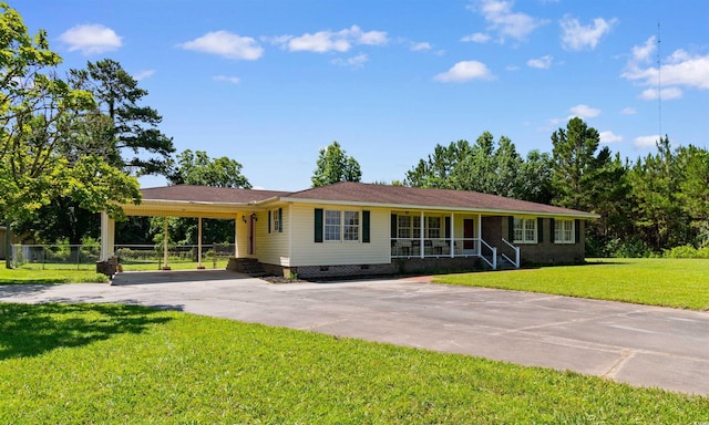 308 Old Stage Rd, Mullins, SC 29574 - ranch-style house featuring a carport, concrete driveway, crawl space, and a porch
