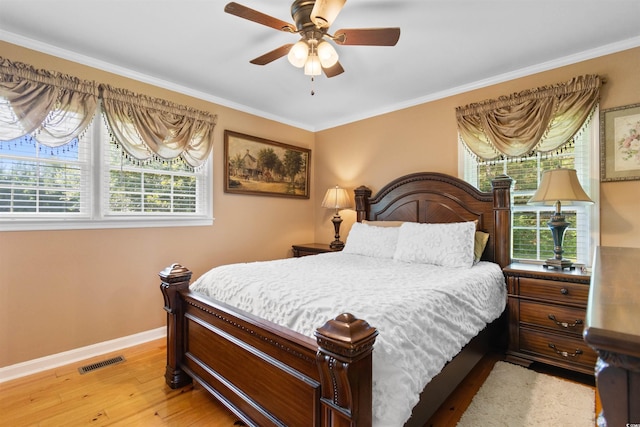 308 Old Stage Rd, Mullins, SC 29574 - bedroom featuring baseboards, light wood-style flooring, crown molding, and a ceiling fan