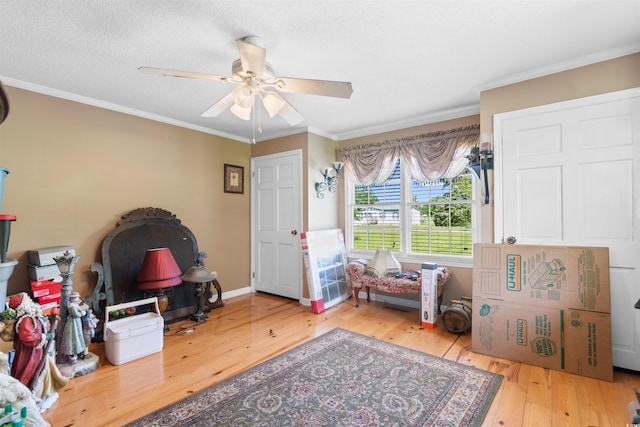 308 Old Stage Rd, Mullins, SC 29574 - living area featuring wood-type flooring, a ceiling fan, crown molding, and baseboards